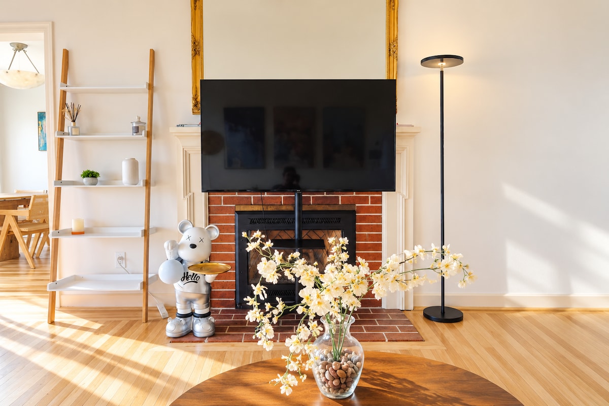 Living room fireplace and TV in the Berkeley Hills home