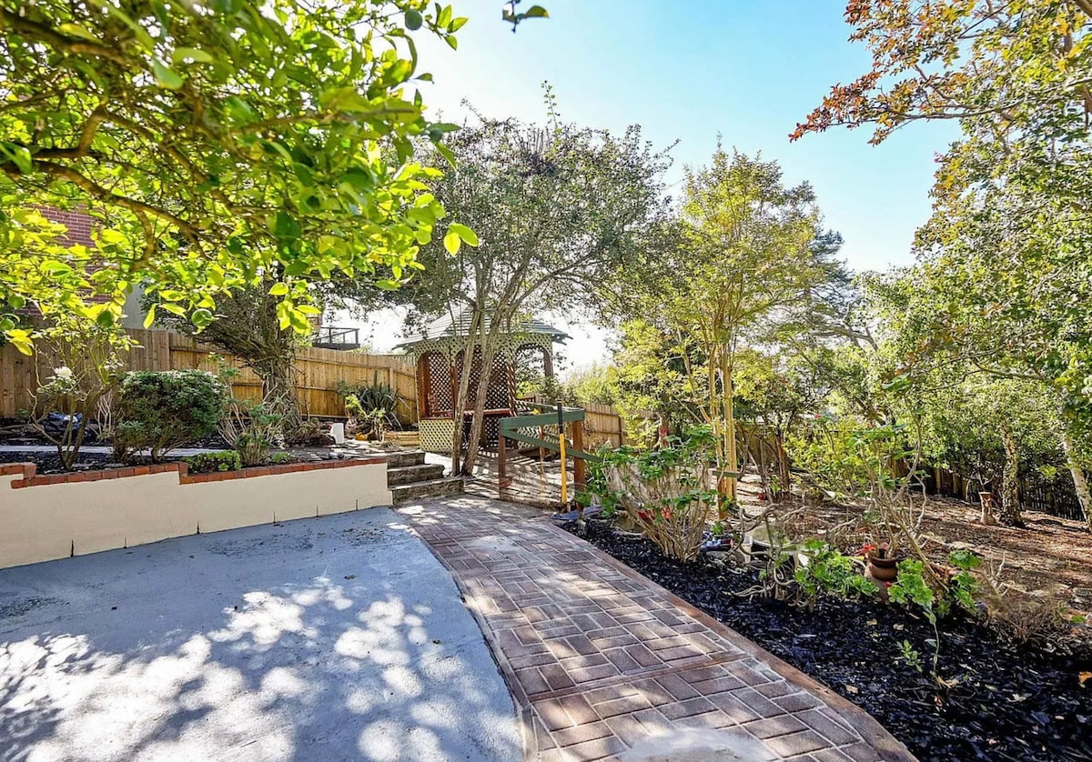 Shared garden path and gazebo outside the studio