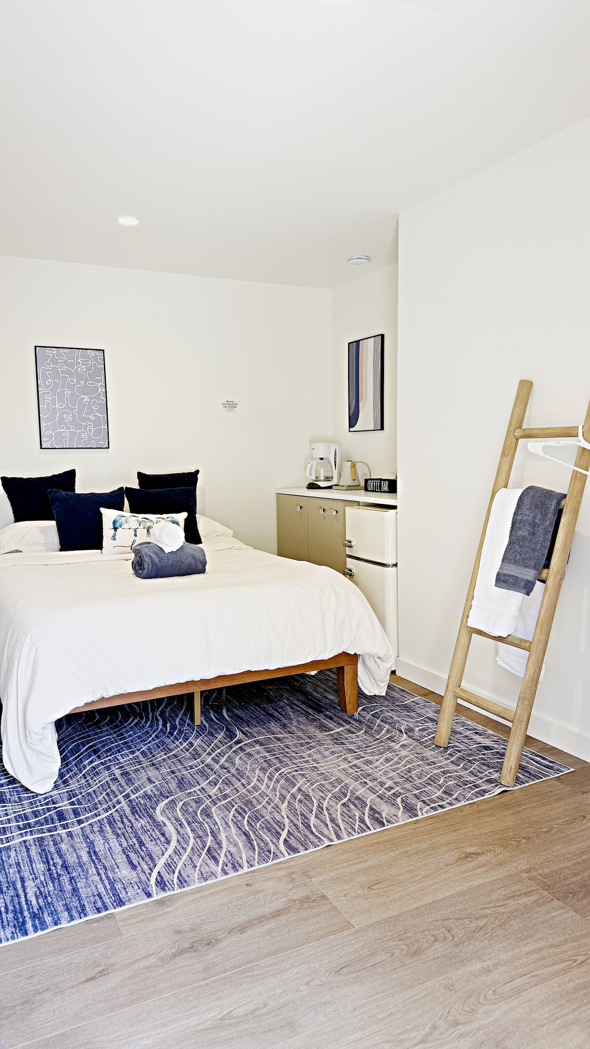 Sunny private suite with bed and kitchenette